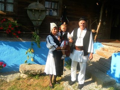 The guesthouse hosts, in traditional folk costume