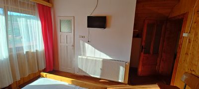 Inside one of the rooms, with wood-panelled walls