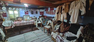 Inside the house-museum, with traditional woven textiles