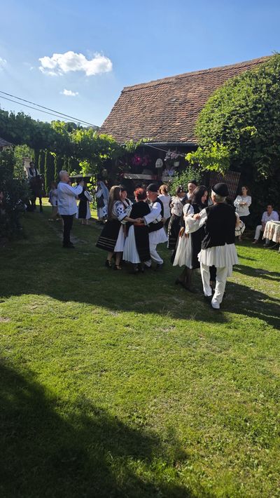 Folk dancing in the courtyard, at a party hosted at the guesthouse