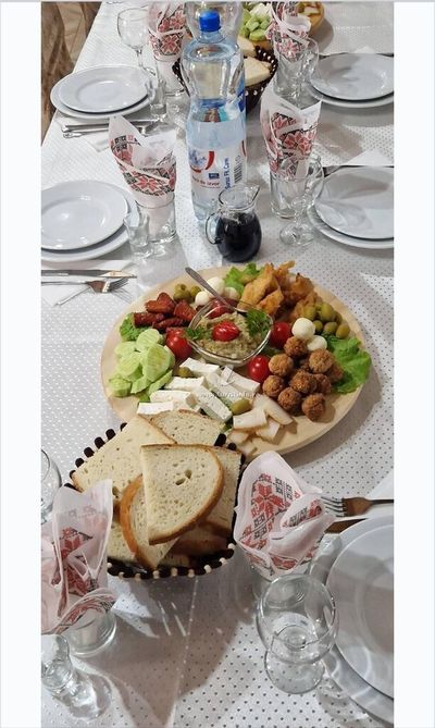 A platter of appetizers and fresh bread, for guests