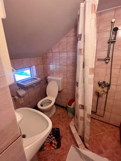 A private bathroom, with a window overlooking the courtyard