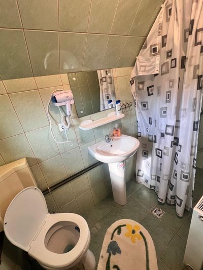 A private bathroom, with shower, sink and toilet