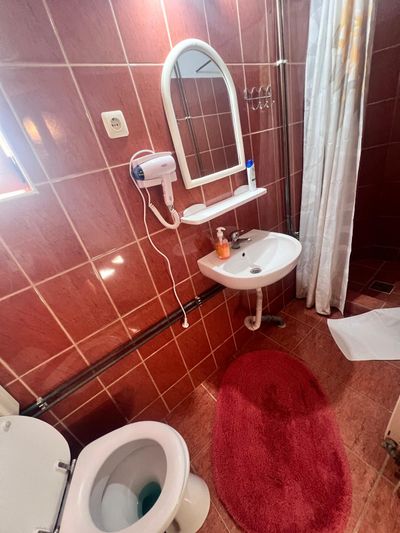A private bathroom, with shower and mirror