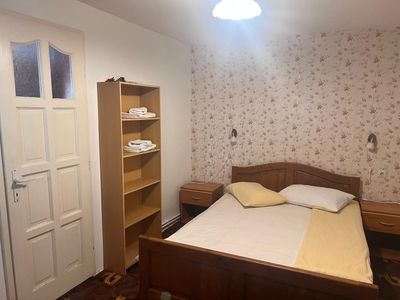 A double room, with floral wallpaper