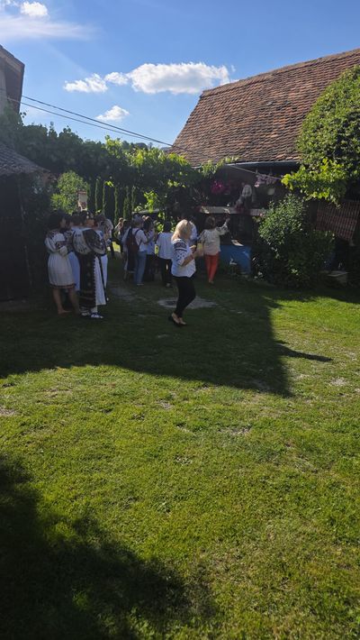 Guests gathered in the courtyard, at a party hosted at the guesthouse